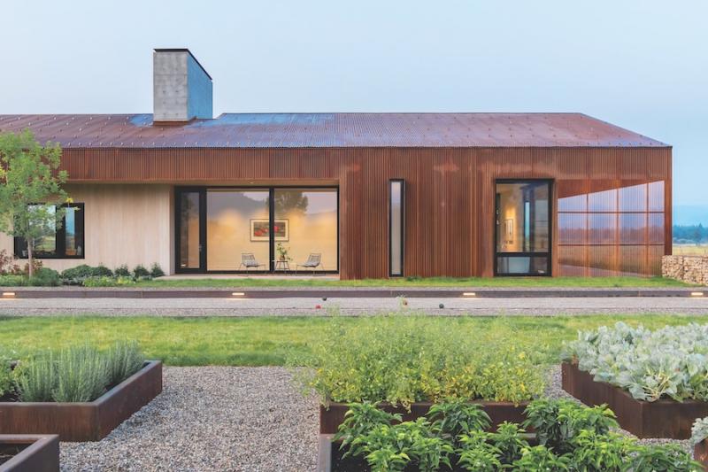 Metal roof on dogtrot barn high-performance home