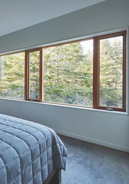 Bedroom with a view of the forest trees