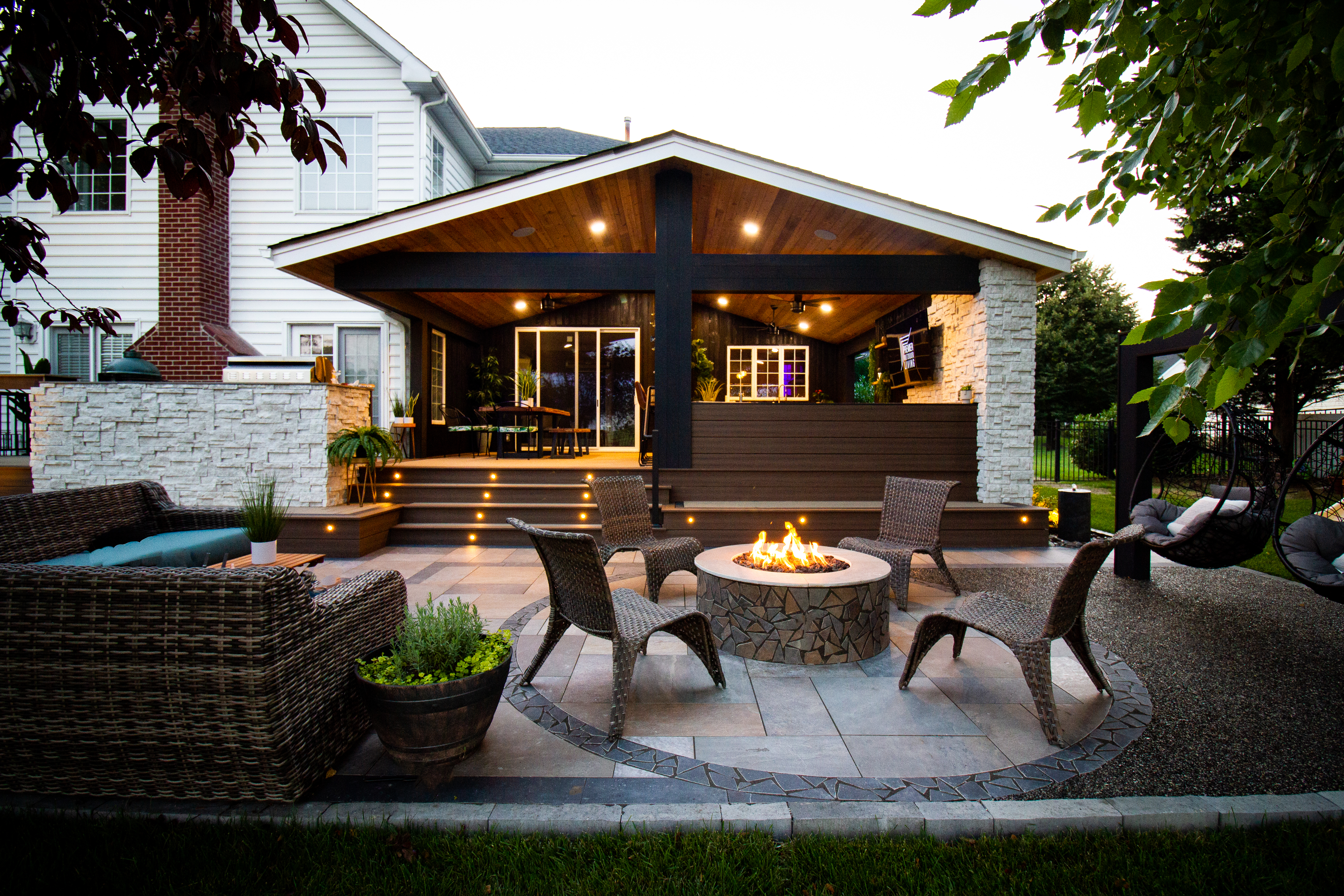 outdoor living space with a fire/heating element