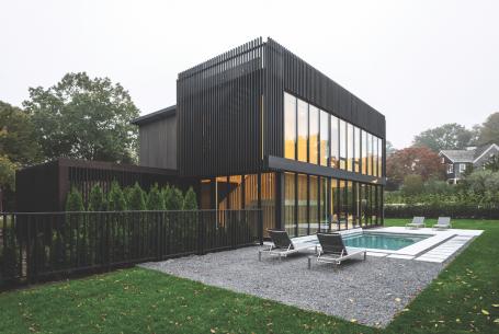 Modern style custom home using black stained cedar