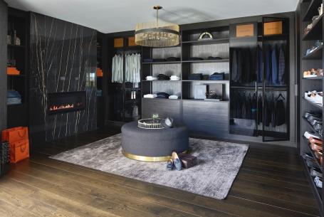 His master closet with fireplace designed by Yelena Gerts